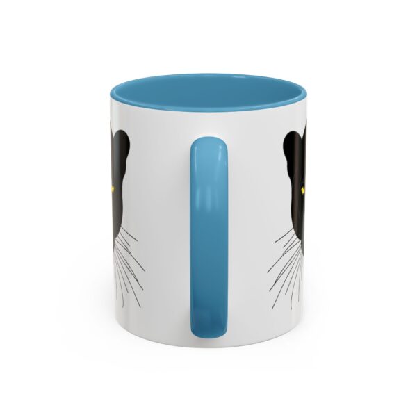 A blue and white mug with a cat on it