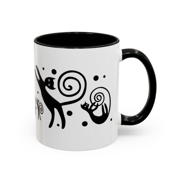 A black and white mug with an animal design.