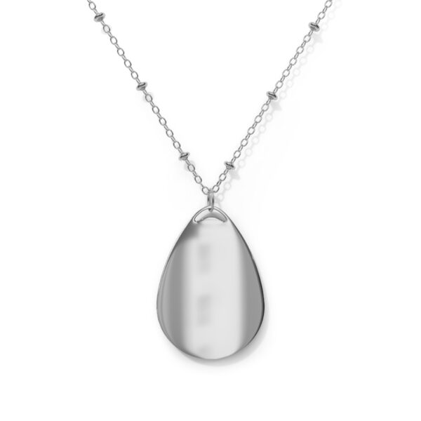 A silver necklace with a large tear drop shaped pendant.