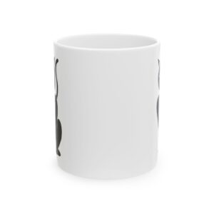 A white coffee mug with a black and white design.