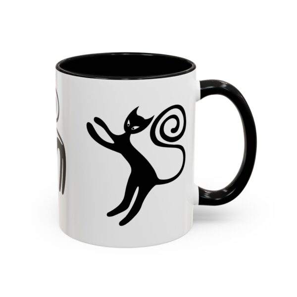 A black and white mug with a cat on it