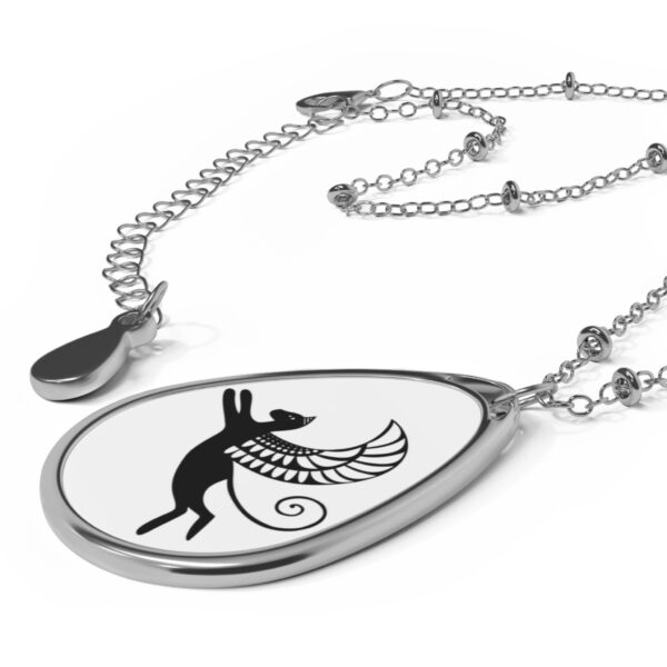 A necklace with an image of a rabbit and a bird.