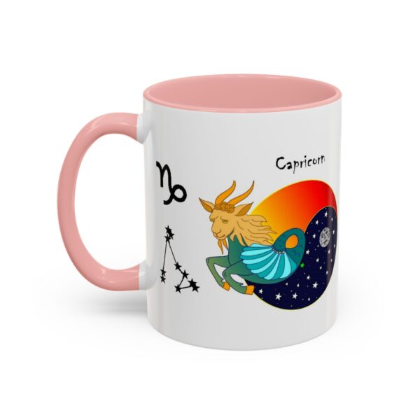 A pink and white mug with an illustration of capricorn