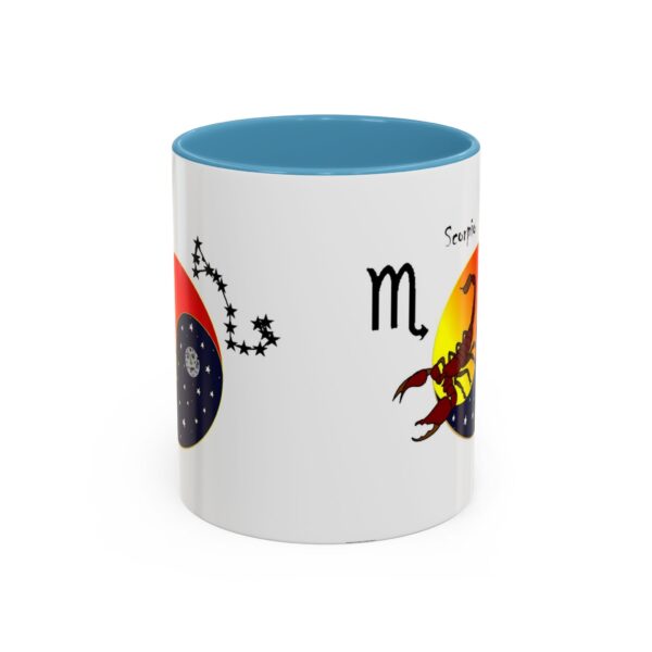 A blue and white mug with the zodiac sign scorpio on it.