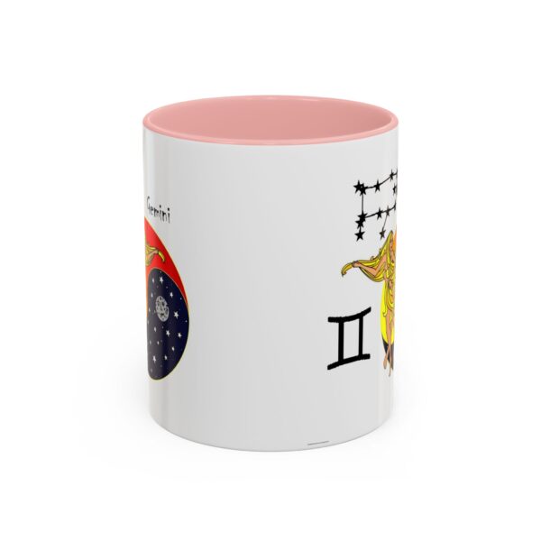 A pink and white mug with the zodiac sign gemini on it.