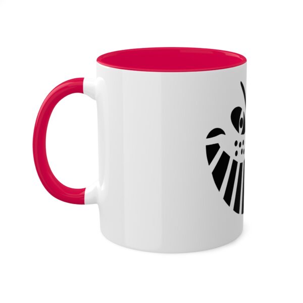 A red and white mug with the image of an owl.