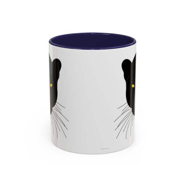 A white and blue mug with a black cat on it.