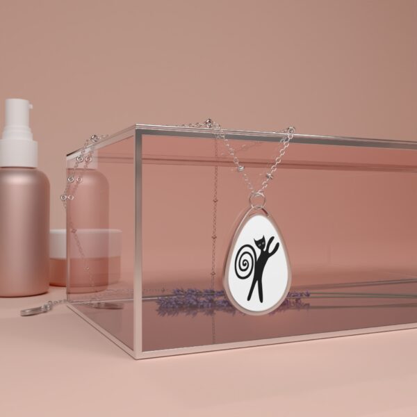 A necklace that is on top of a glass case.