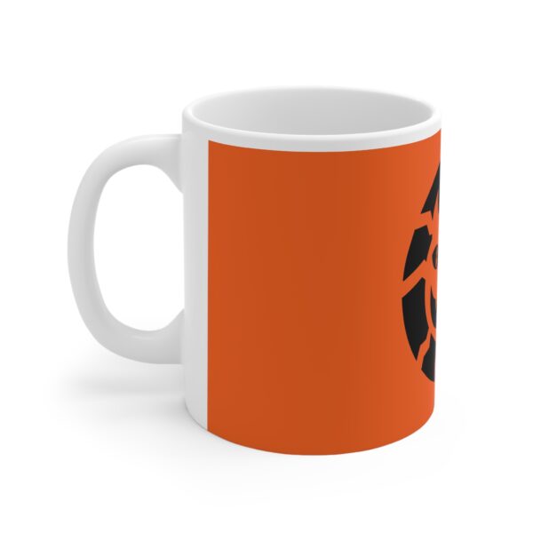 A white coffee mug with an orange background and black logo.