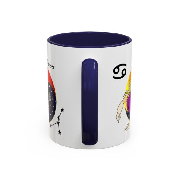 A blue and white mug with an image of the zodiac sign.