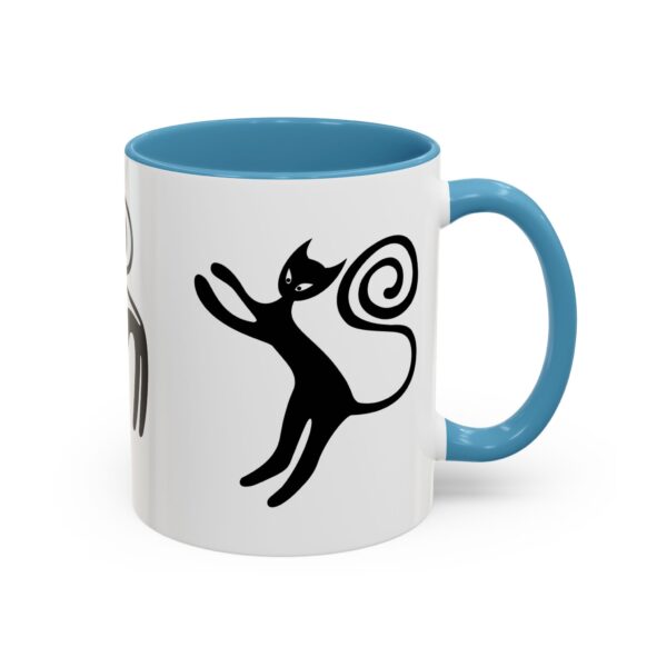 A blue and white mug with an image of a cat.