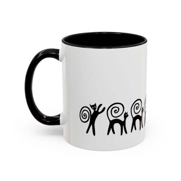 A black and white mug with an image of a person holding something.