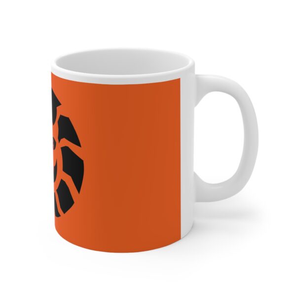 A white mug with an orange background and black logo.