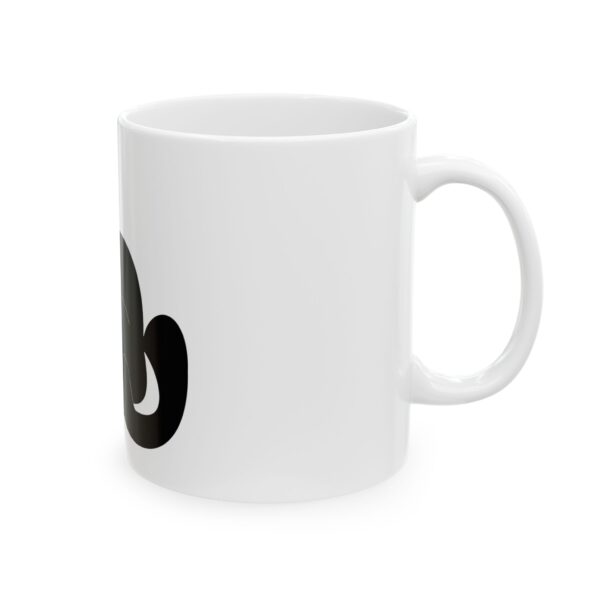 A white coffee mug with the letter e on it.