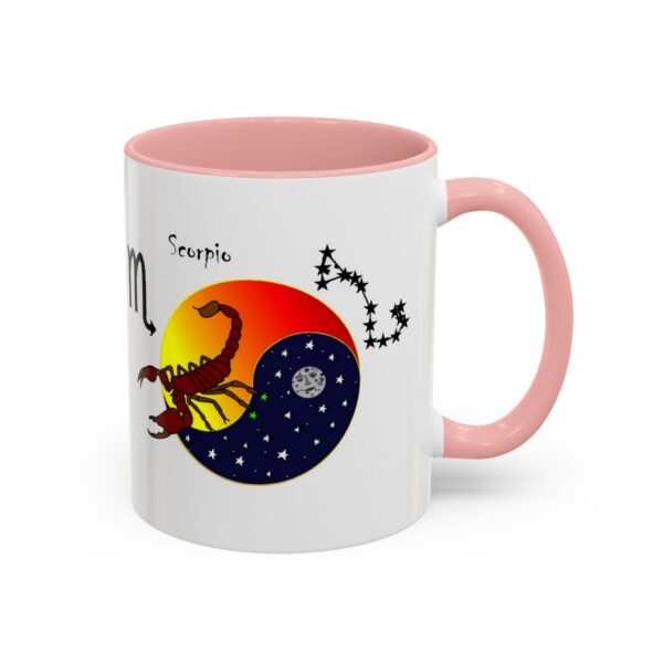 A pink and white mug with the zodiac sign scorpio on it.