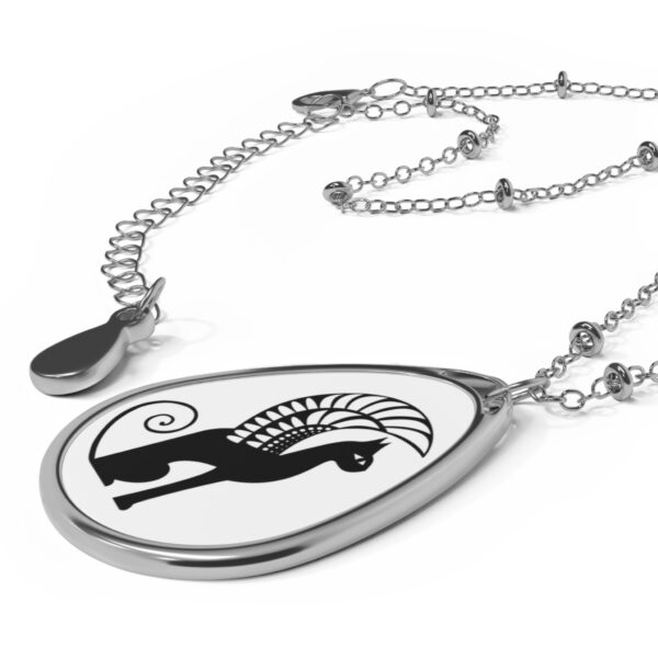 A necklace with a black and white design on it