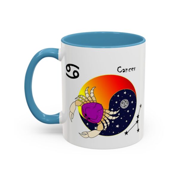 A blue and white coffee mug with a picture of a scorpio.