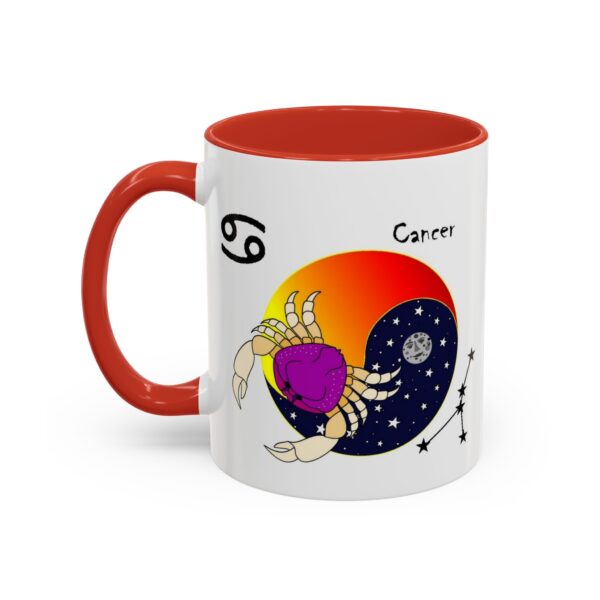 A red and white coffee mug with the zodiac sign cancer on it.