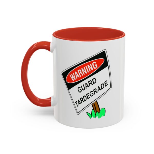 A red and white mug with a warning sign on it