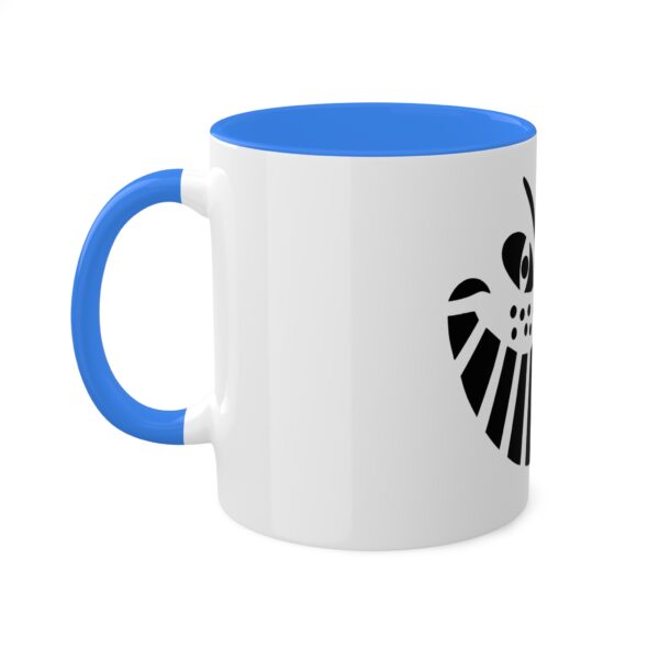 A blue and white mug with the symbol for the house of lyra.