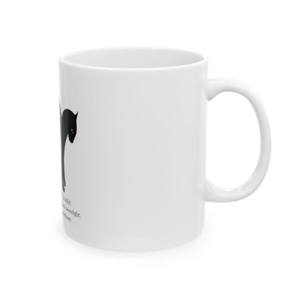 A white coffee mug with an image of a cat.