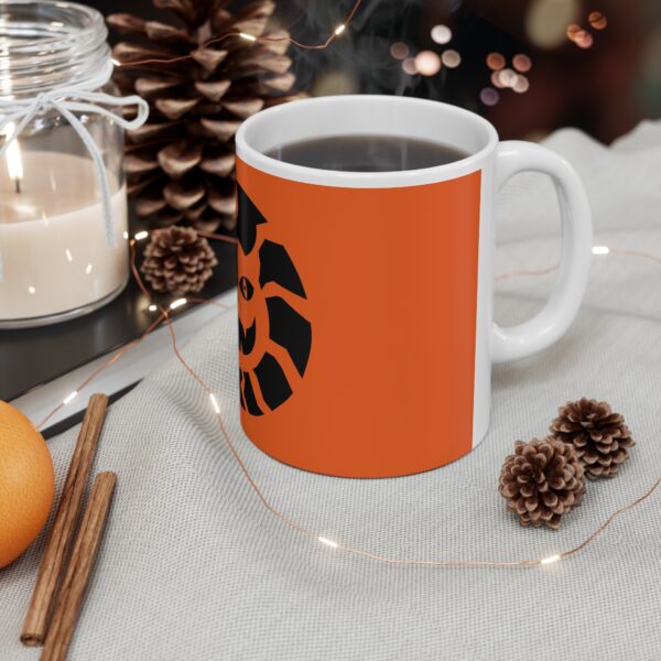 A coffee mug sitting on top of a table.