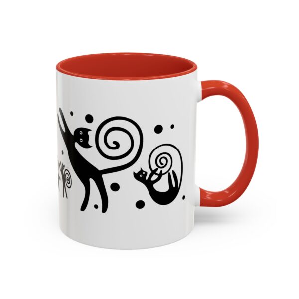 A red and white coffee mug with an animal design.