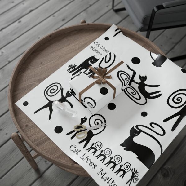 A table with a cat themed cover on it