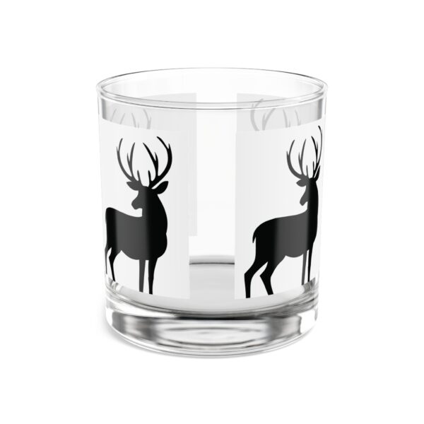 A glass with deer on it