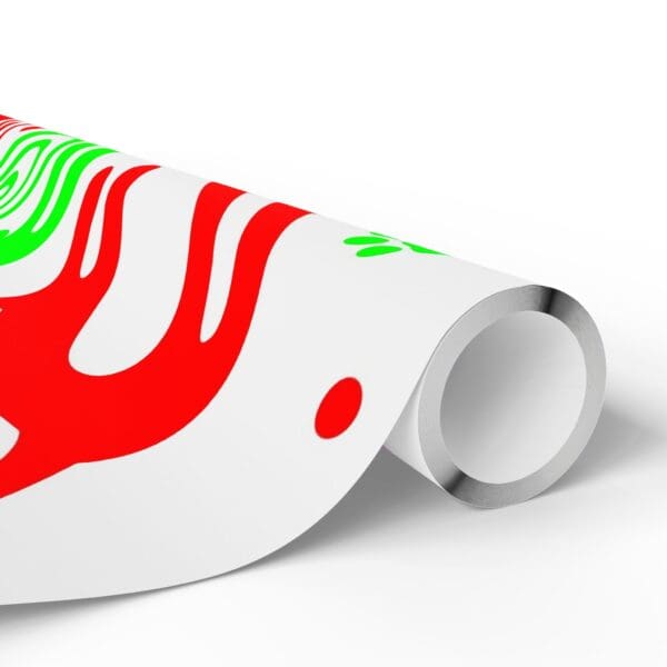 A roll of wrapping paper with red and green designs.