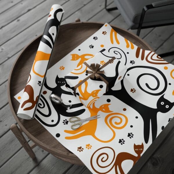 A cat themed table cloth and napkin set