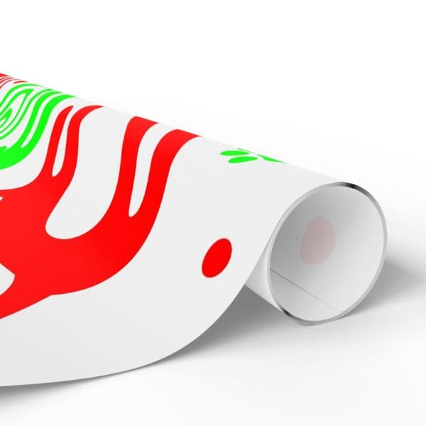 A roll of paper with red and green designs on it.