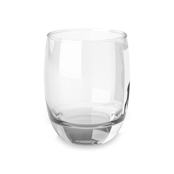 A glass is sitting on the ground.