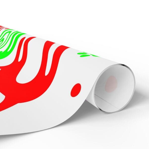 A roll of paper with red and green designs on it.