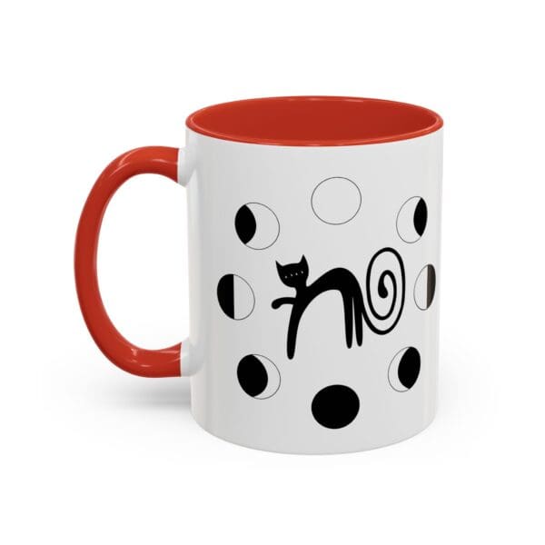 Black cat design on white mug.