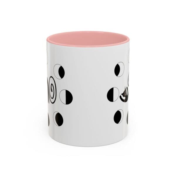 White mug with playful black patterns.