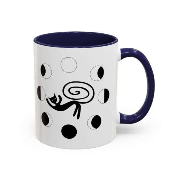 Black cat design on a coffee mug.