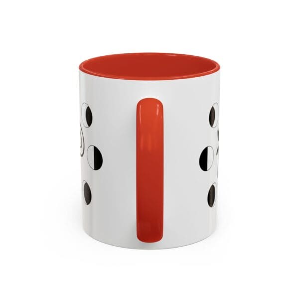 Colorful mug with cut-out designs.