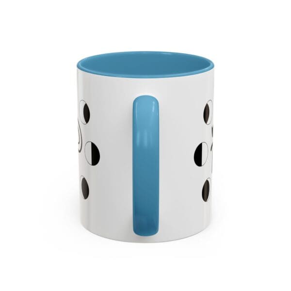 Blue-handled mug with circular cutouts.