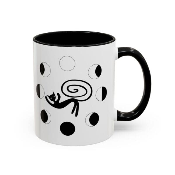 Black and white mug with cat design.