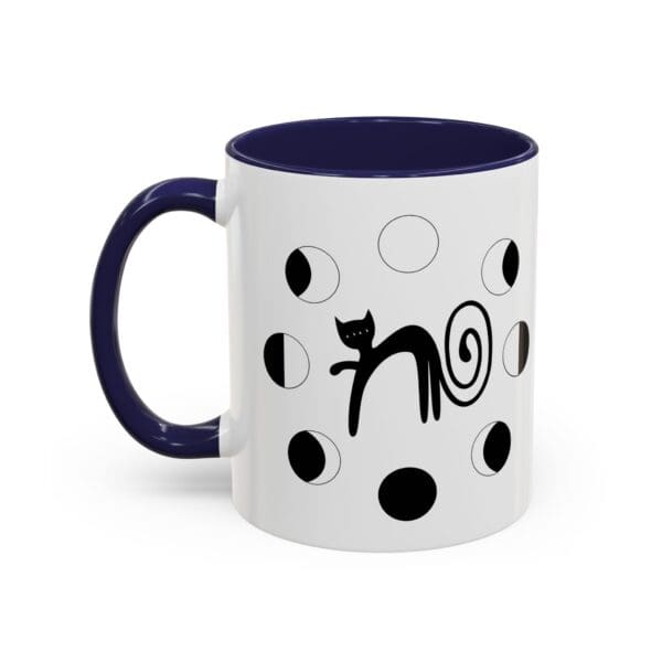 Black cat design on a white mug.