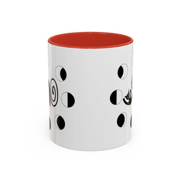 White mug with black abstract designs.