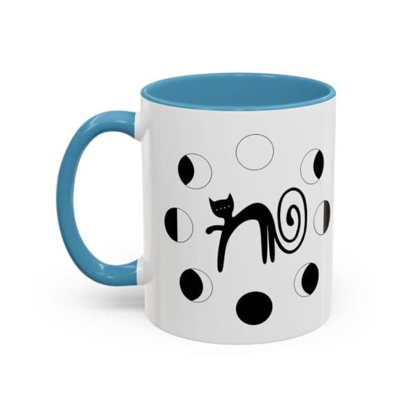 Black cat design on a blue mug.