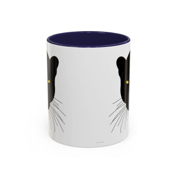 Black cat-themed mug with yellow eyes.