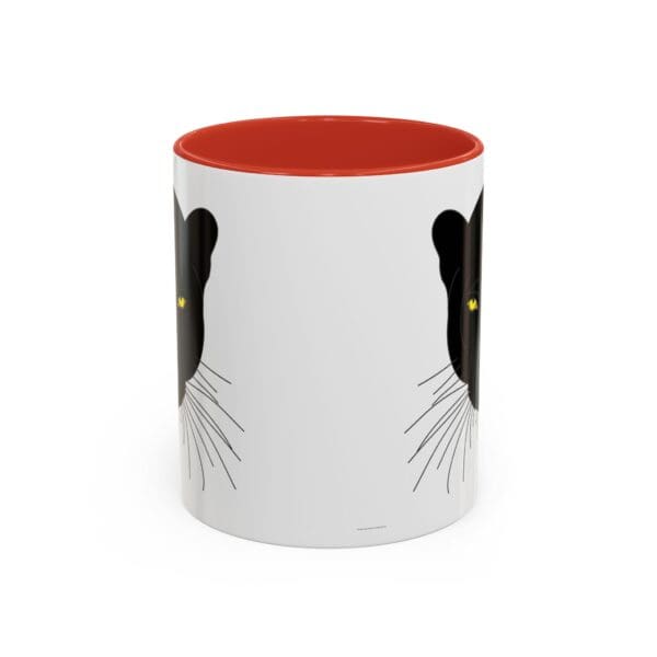 Black cat design on a white mug.