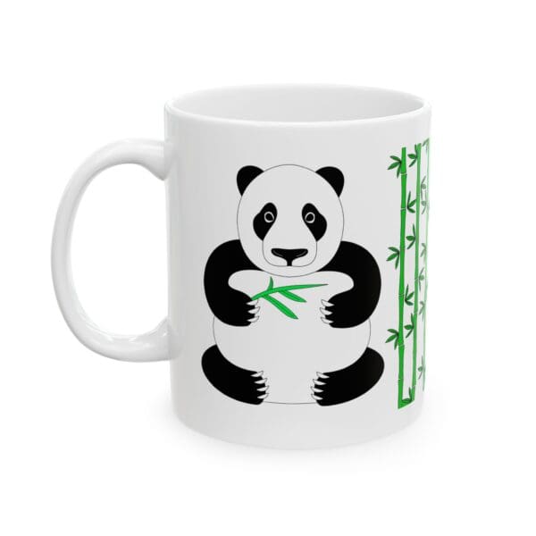 Panda holding bamboo on a coffee mug.