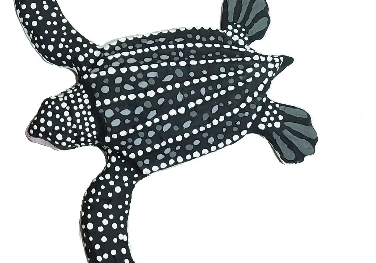 Decorative turtle with black and white patterns.