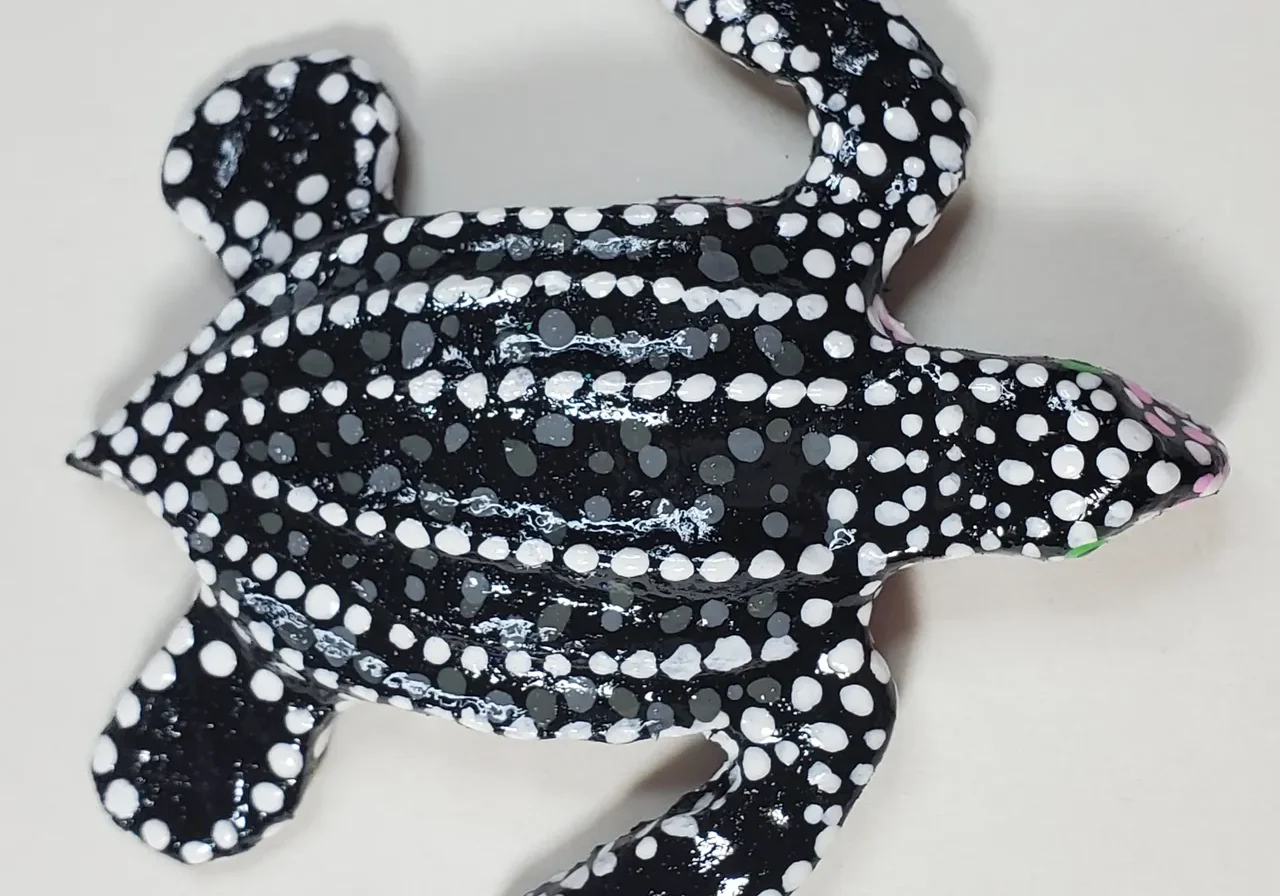 Decorative black and white turtle sculpture.