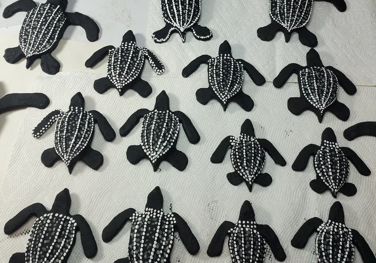 Black and white turtles made of clay.