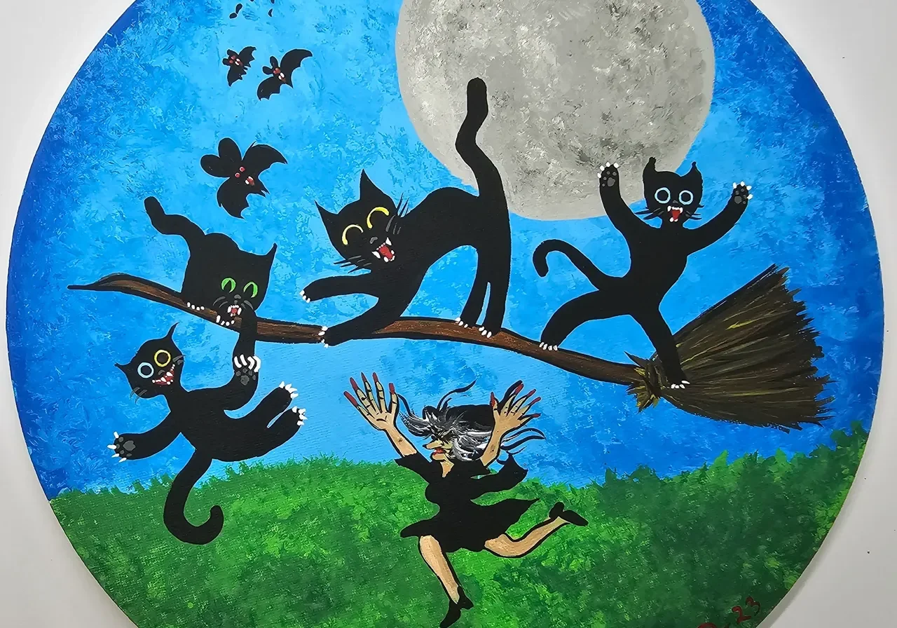 Cats and a witch flying on a broomstick.